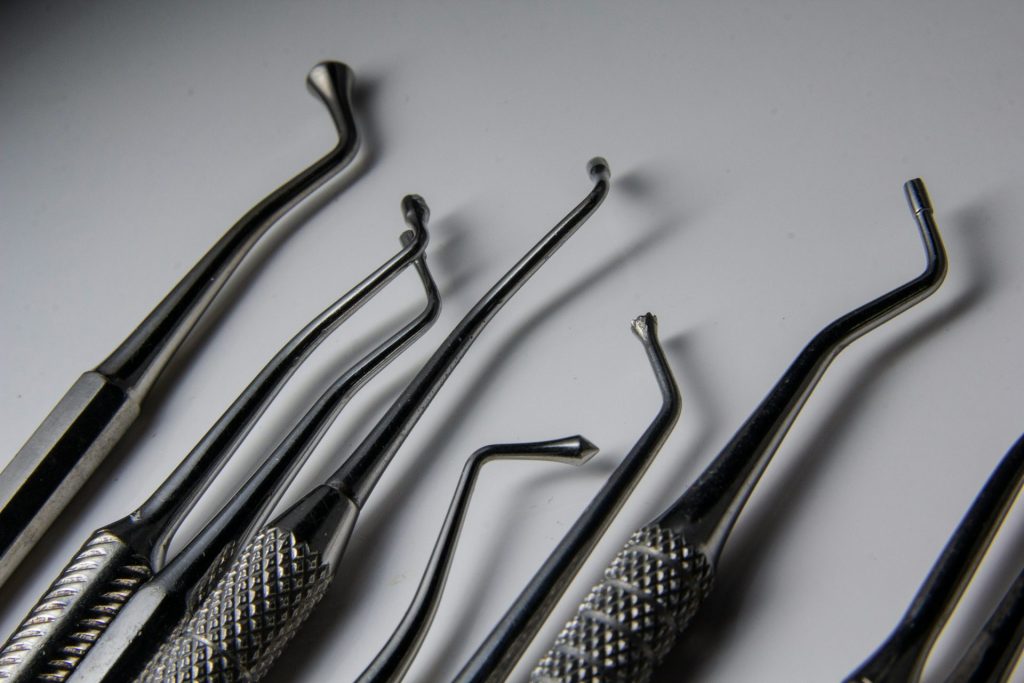 a group of dental tools sitting on top of a table